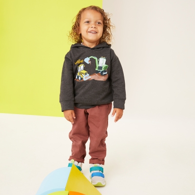 Kids love our dark grey hoodie featuring construction vehicles.