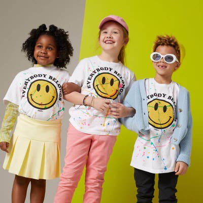 3 kids wearing their unique shirts.