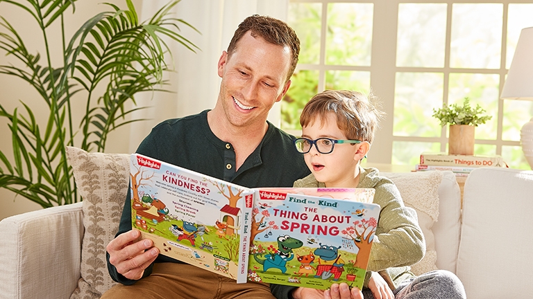 A grown-up and child reading a Find the Kind book.