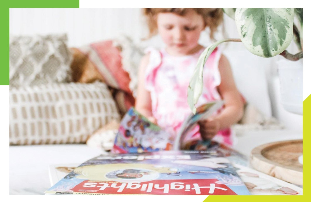 Young girl combing through various Highlights products